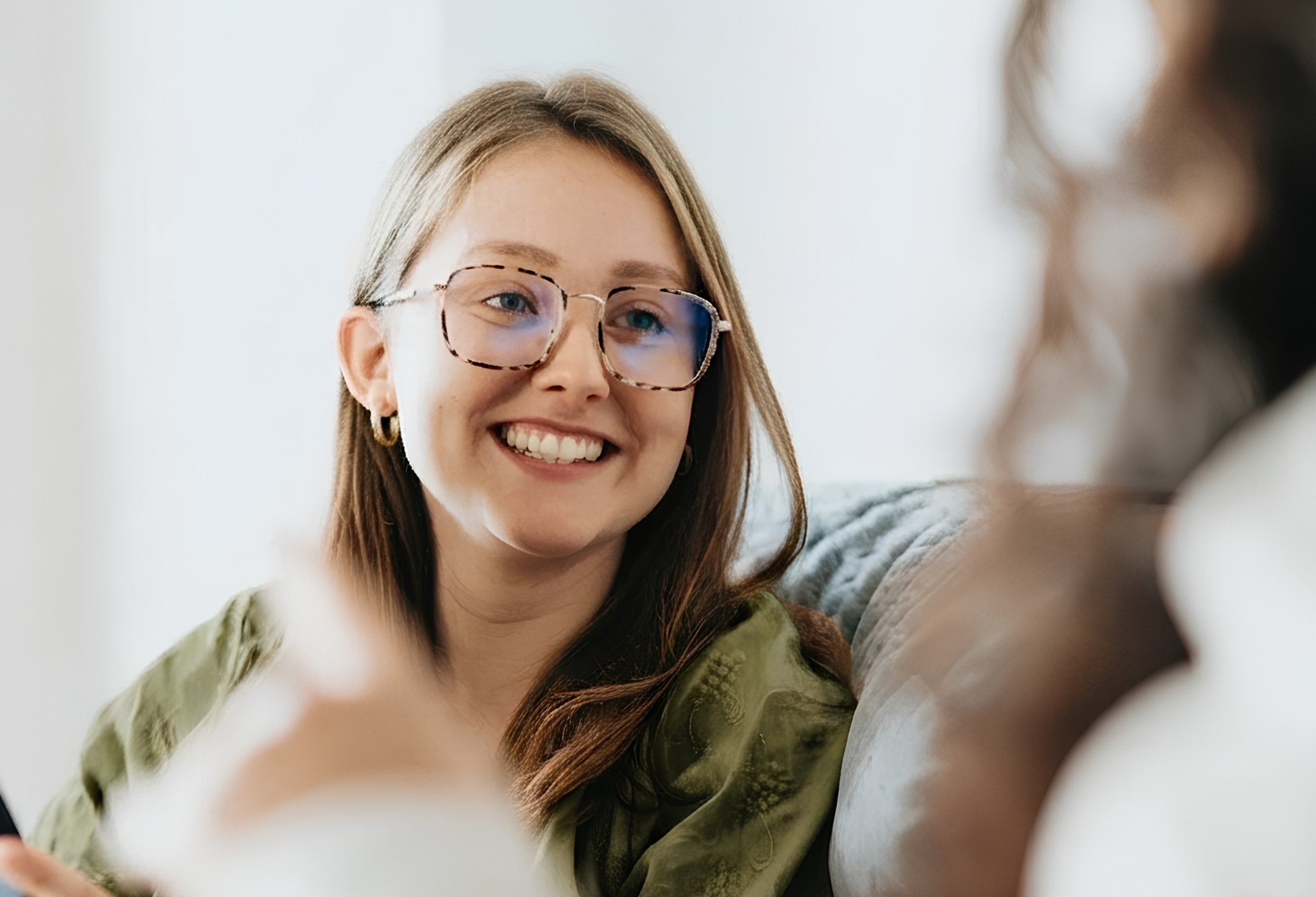 Smiling adult outdoors, adult therapy at Unfold Psychology