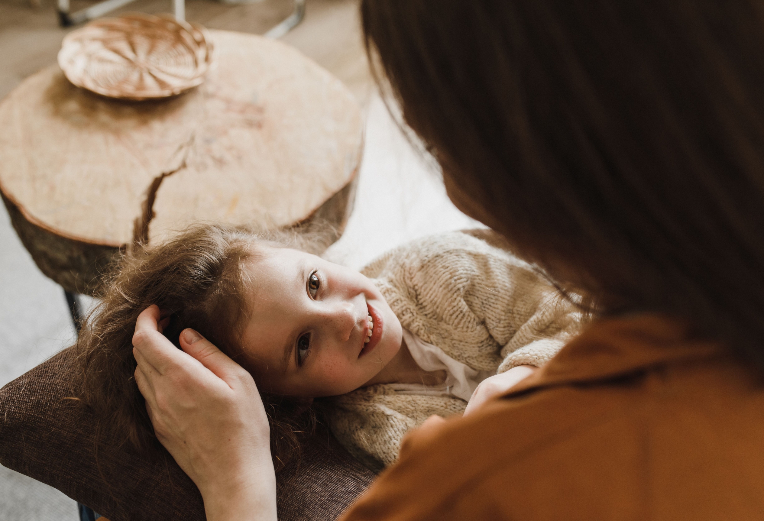 Parent holding a child close, child custody evaluations